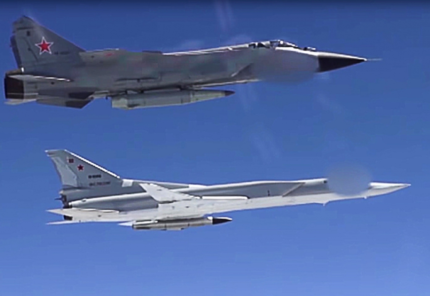 Russian fighters armed with Kinzhal hypersonic missiles hold drills with strategic bombers